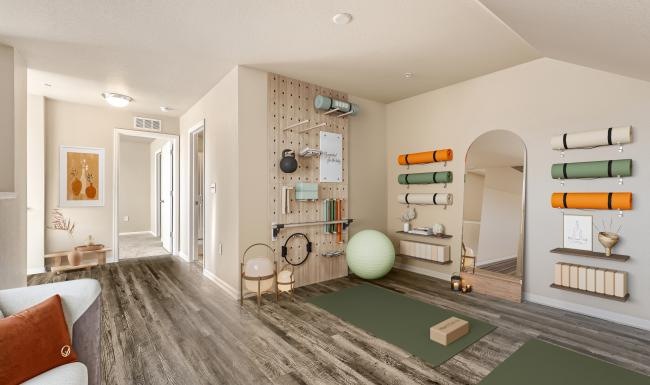 a workout room with shelves of pilates equipment