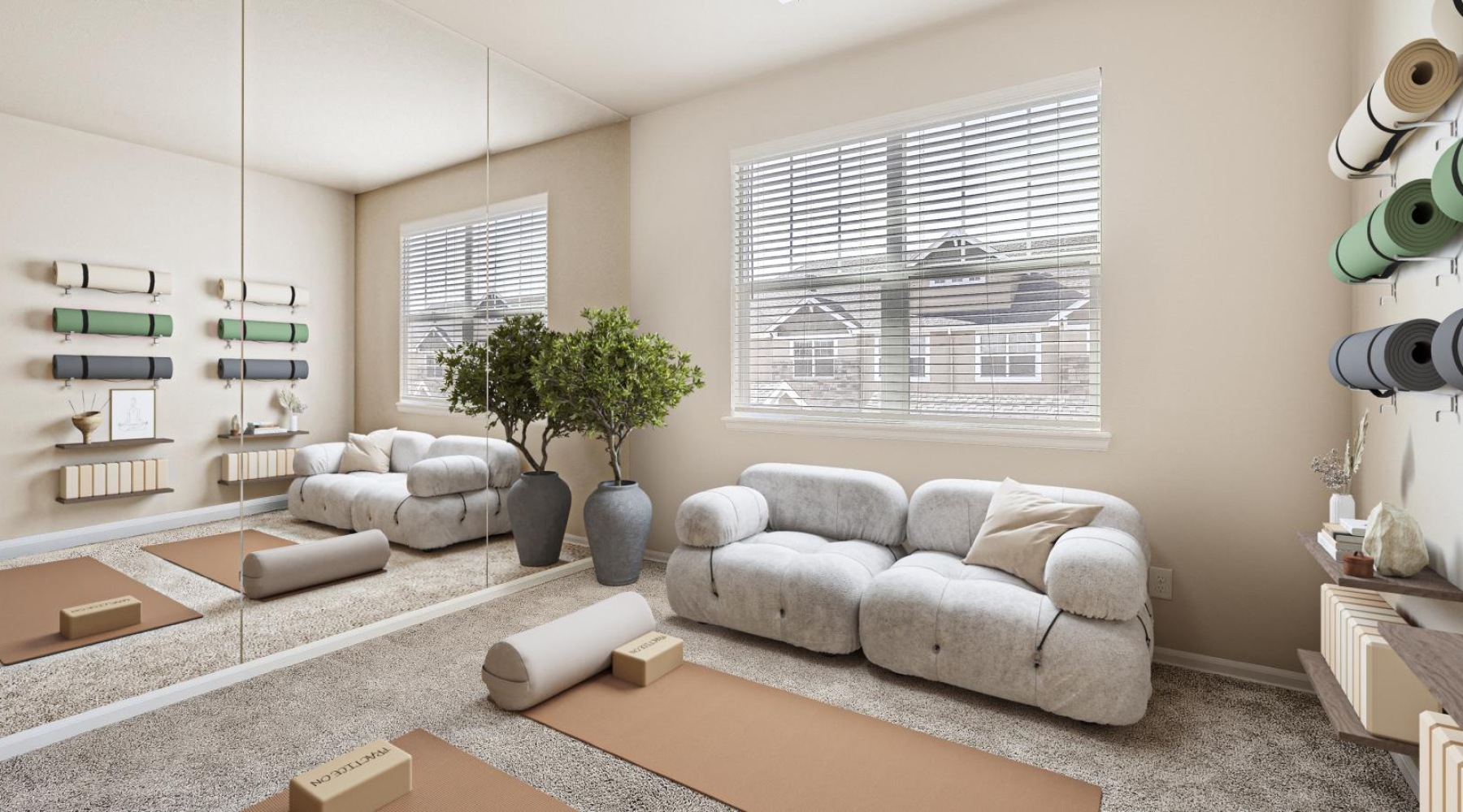 a workout room with a white couch and mats