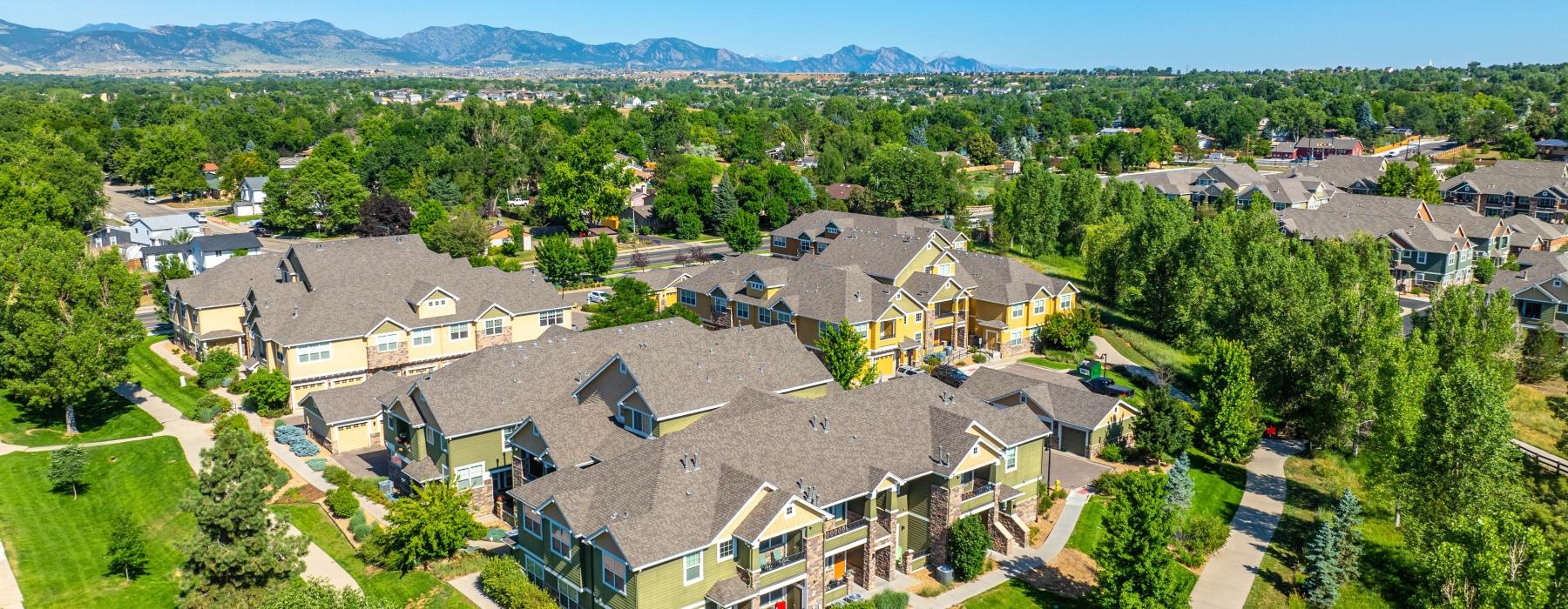 a large building complex surrounded by trees